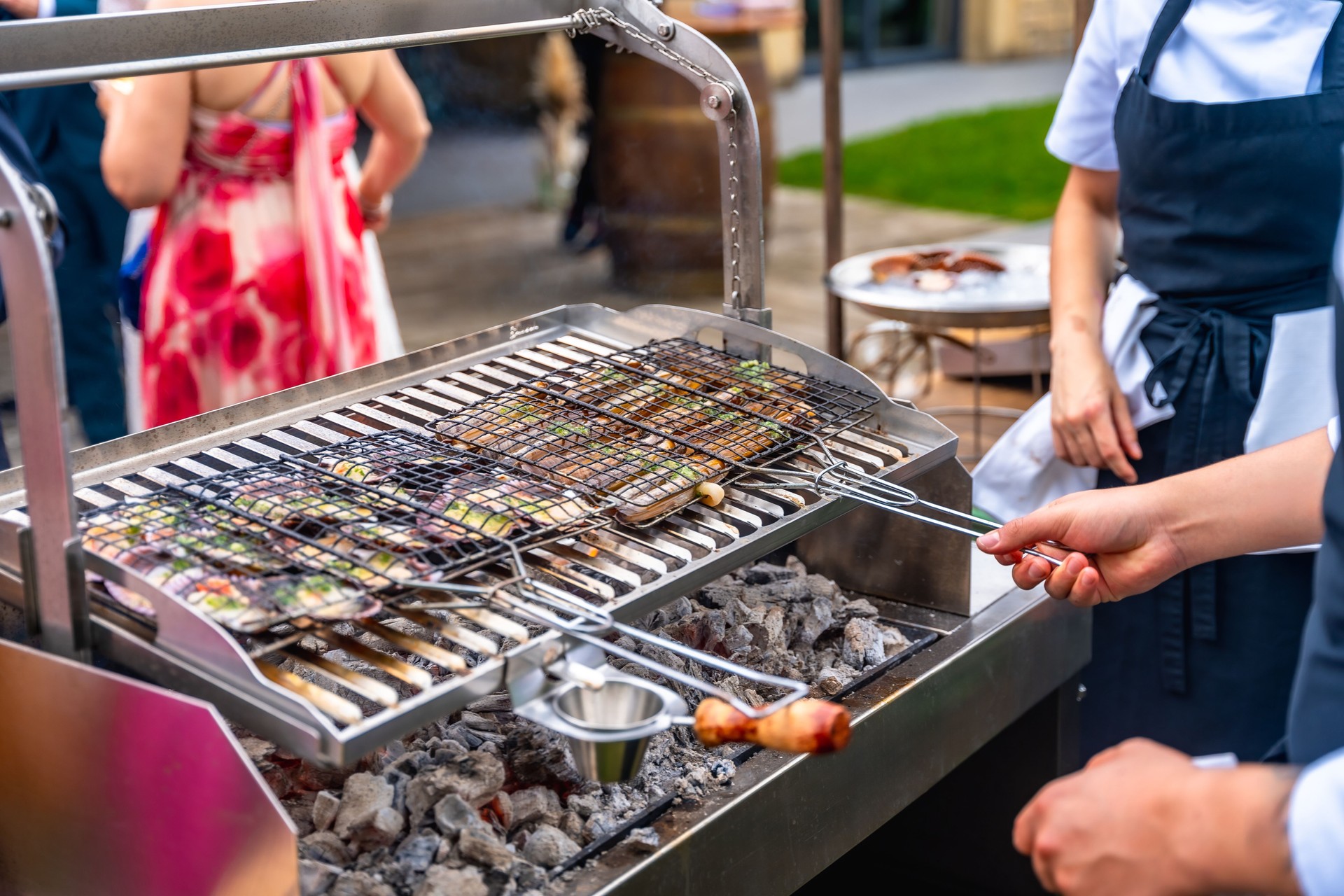 Outdoor wedding barbecue with grilled fish
